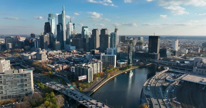 Aerial of Schuylkill River and Philadelphia city skyline. Beautiful cinematic establishing shot.
