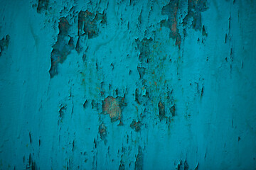 Cracked paint on a metal plate.