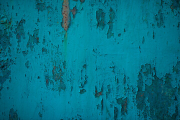 Cracked paint on a metal plate.