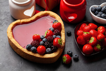 Heart shaped sweet cake with berries