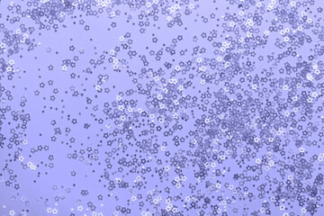 Trendy Color of year 2022. Stars Confetti on violet background. Festive backdrop