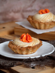 cakes with sweet cream on plates