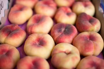 Ripe peaches close-up on the counter.