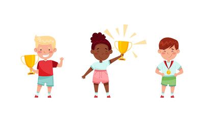 Kids celebrating victory in game competition with gold trophy cup and medal set vector illustration