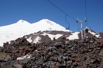 Beautiful snow-capped mountain peaks of the Caucasus Mountains next to the highest peak in Europe - Elbrus