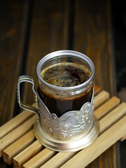 coffee in a vintage glass on a dark background