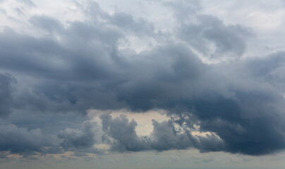 Obraz premium Image of dramatic dark cloudy sky over sea, natural photo background