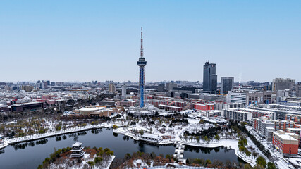 Fototapeta premium Early morning snow in the city-winter scenery in the urban area of Changchun, China