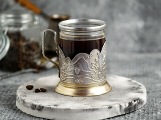 coffee in vintage glass on gray background 