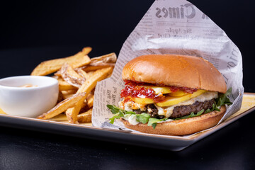 details of tasty black angus beef burger with gorgonzola