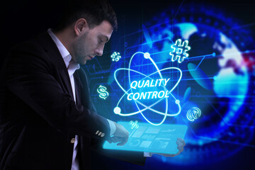 Business, Technology, Internet and network concept. Young businessman working on a virtual screen of the future and sees the inscription: Quality control