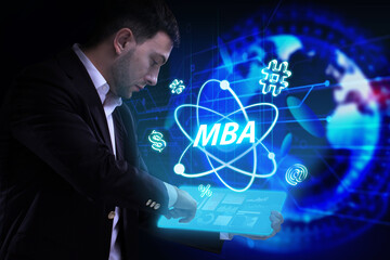 Business, Technology, Internet and network concept. Young businessman working on a virtual screen of the future and sees the inscription: MBA