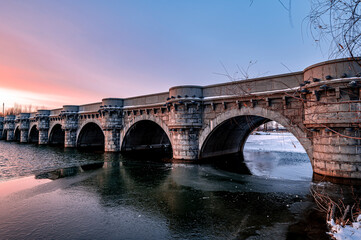 Fototapeta premium Winter scenery of the North Lake National Wetland Park in Changchun, China under the sunset