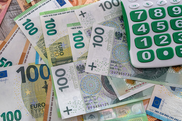 Fototapeta na wymiar exchange concept pln polish money with euro bills and calculator