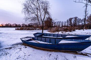 Winter scenery of the North Lake National Wetland Park in Changchun, China under the sunset