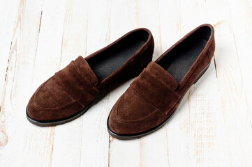 Dark brown suede slippers. Close-up shot.