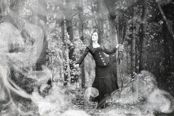 Woman in a witch suit in a dense forest