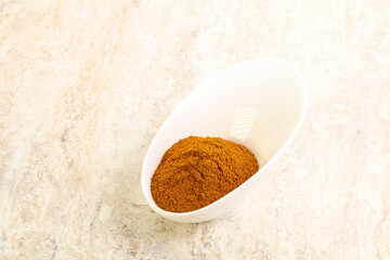 Dry Paprika powder in the bowl