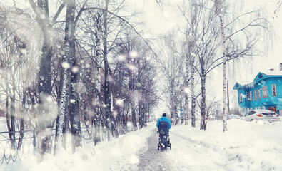 Winter forest landscape. Tall trees under snow cover. January frosty day in the park.