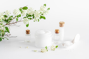 Herbal facial cream cosmetic for skin care with white flowers