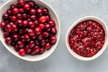 Red berries on a dark background. cranberries in a bowl.