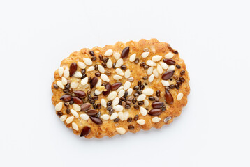 Tasty crackers with seeds on the white background.
