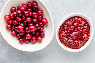 Red berries on a dark background. cranberries in a bowl.