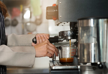Barista hands making coffee for service