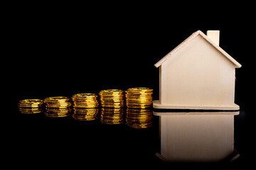 Property investment and house mortgage financial concept with dark background. An economy concept in investment and securing assets.