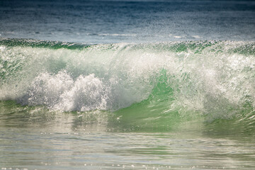 beautiful breaking wave close up in atlantic ocean