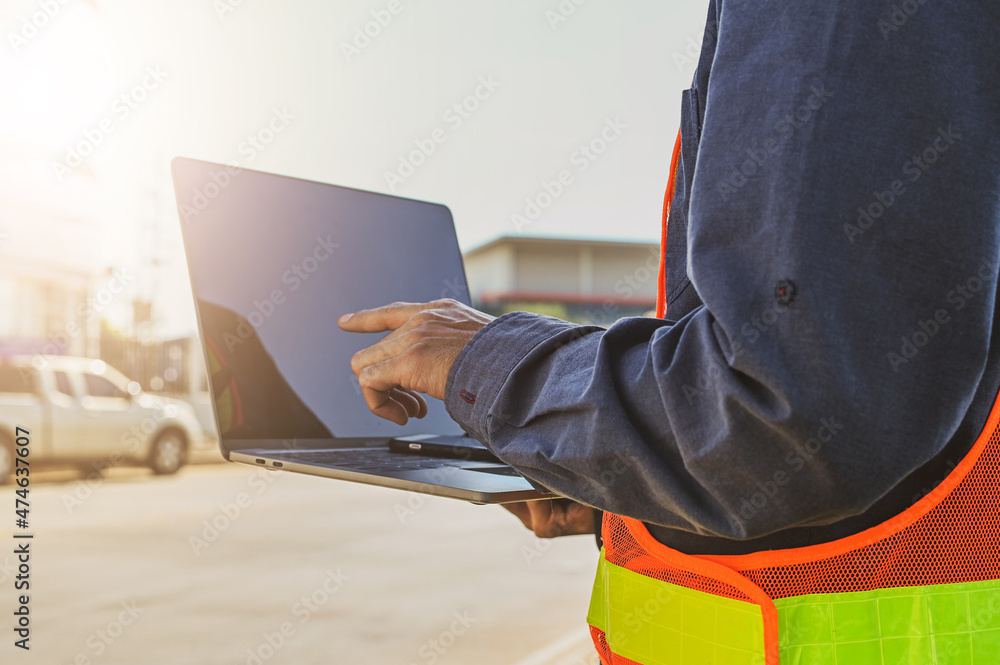 Poster engineer holding laptop computer send data work internet technology , engineer construction inspecti