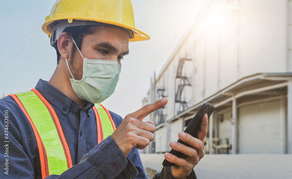 Poster engineer holding smartphone send message internet technology , engineer construction inspection buil