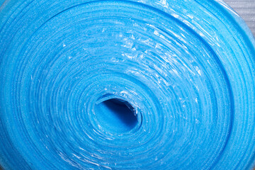 Blue damper tape close up. It is used for installation of flooring. Construction tape for sealing joints.