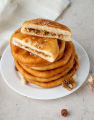 Korean pastry hottok made from yeast dough fried in oil stuffed with nuts and sugar.