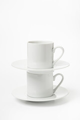 several white porcelain cup and saucer for coffee isolated on white background
