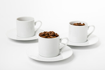 set Perfect small white coffee cup with beautiful ones. roasted coffee beans on white background