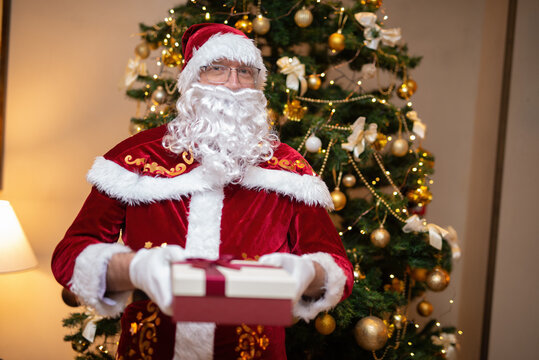 Santa Claus holding a present