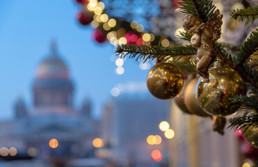 Christmas and New Year decoration on the building in the center of the city. On the background is Saint Isaac Cathedral. Saint-Petersburg. Russia