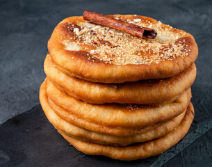 A hottok stack of several pieces on a dark background. Korean street food.