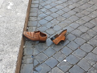 Lost Brown Men's Shoes on a Cobblestone Street in Rome, Italy