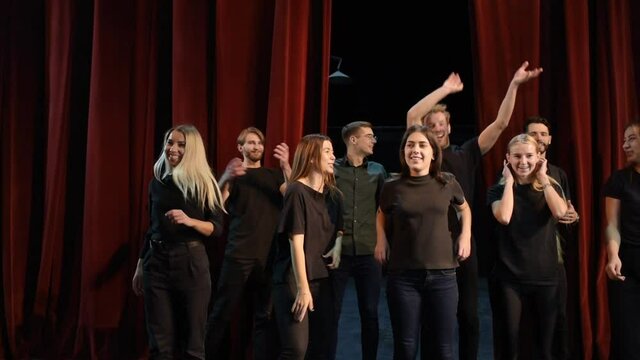 Group of young artists is together on the theater stage have rehearsal