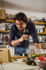 Fototapeta premium man preparing food in his kitchen