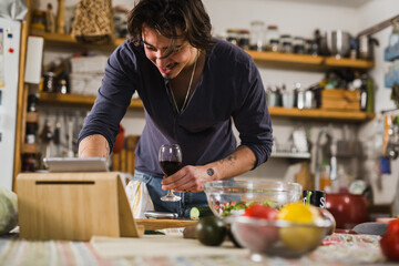 Fototapeta na wymiar man preparing food in his kitchen