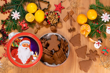Box with Christmas gingerbread on the background of festive new year decor, top view