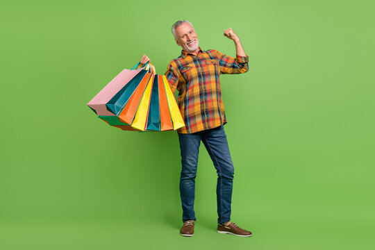 Full body photo of cute aged beard man shopping wear shirt jeans sneakers isolated on green background