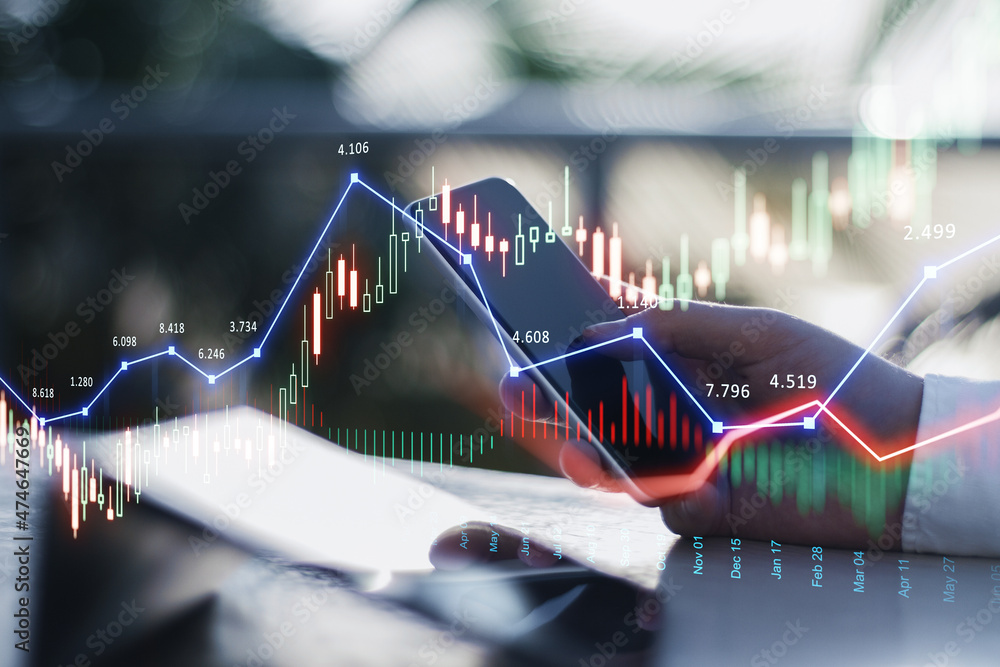 Poster close up of businessman hand using smartphone with glowing forex chart trading interface on blurry o