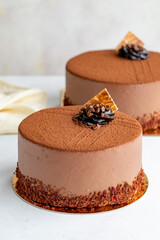 Ganache cake on white background. Vertical view. Close-up celebration cake. Story format