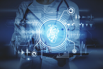 Female doctor using tablet with creative glowing cardiovascular medical hud screen on blurry hospital interior background. Online medicine, cardiology and health concept. Double exposure.