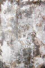 Cracked plaster wall texture, damaged walls exposed to sunlight and rain