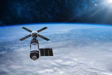 Cargo space craft Earth planet.Dark background. Sci-fi wallpaper.Space Station Orbiting Earth.Space ship.Space art wallpaper.Solar Observatory.Elements of this image furnished by NASA.3D illustration © Ivan